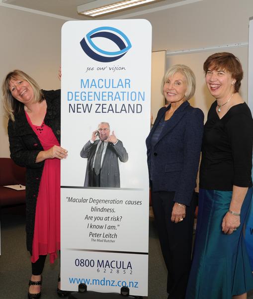 Newly appointed MDNZ General Manager Jeanine Gribbin with Ambassador Dame Rosie Horton and Chair Dr Dianne Sharp, standing with signage featuring Ambassador Sir Peter Leitch.